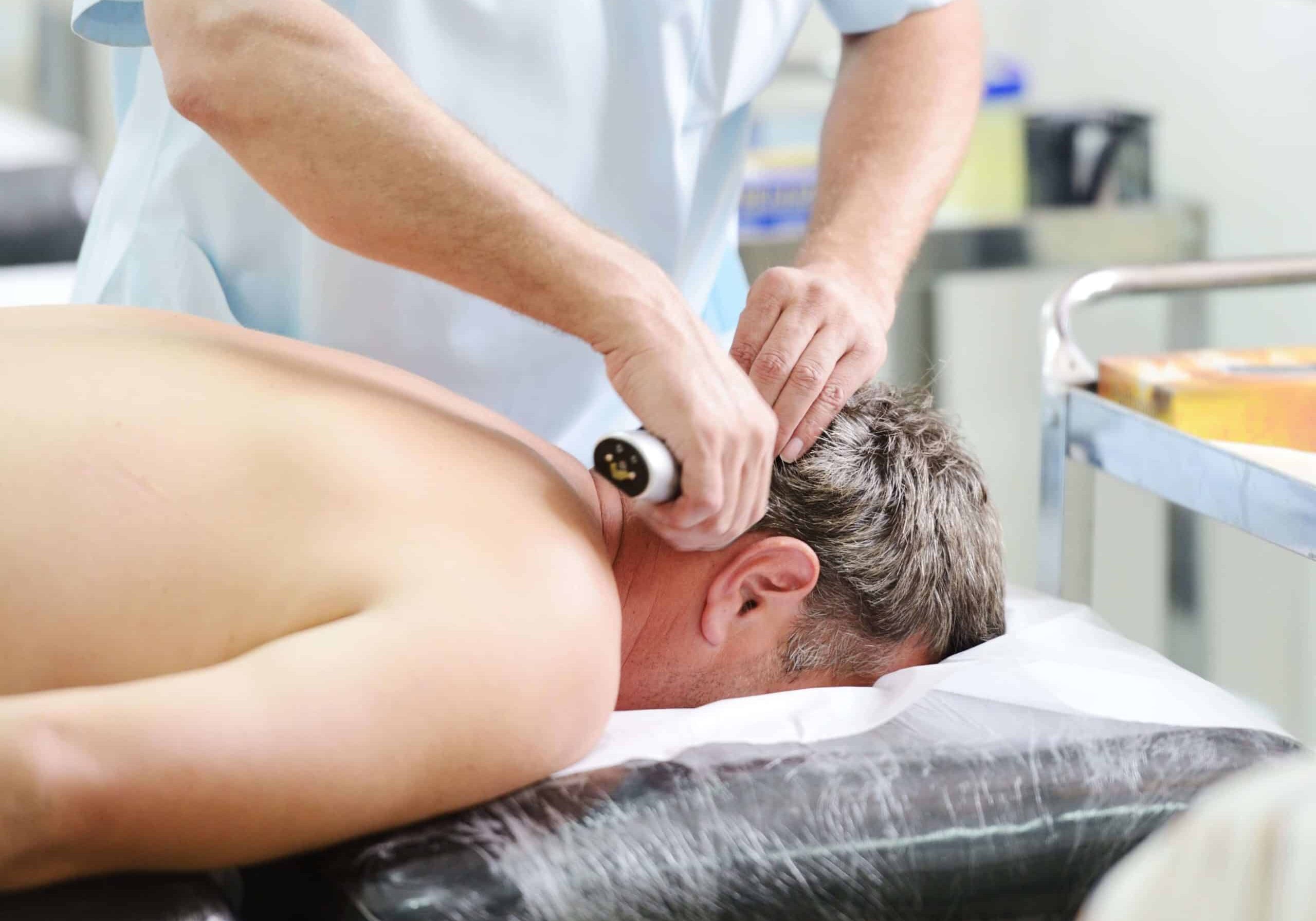 male receiving chiropractic care treatment