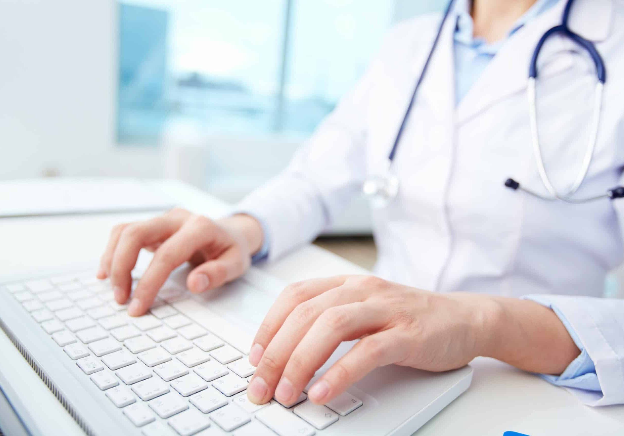 close-up-of-a-medical-worker-typing-on-laptop