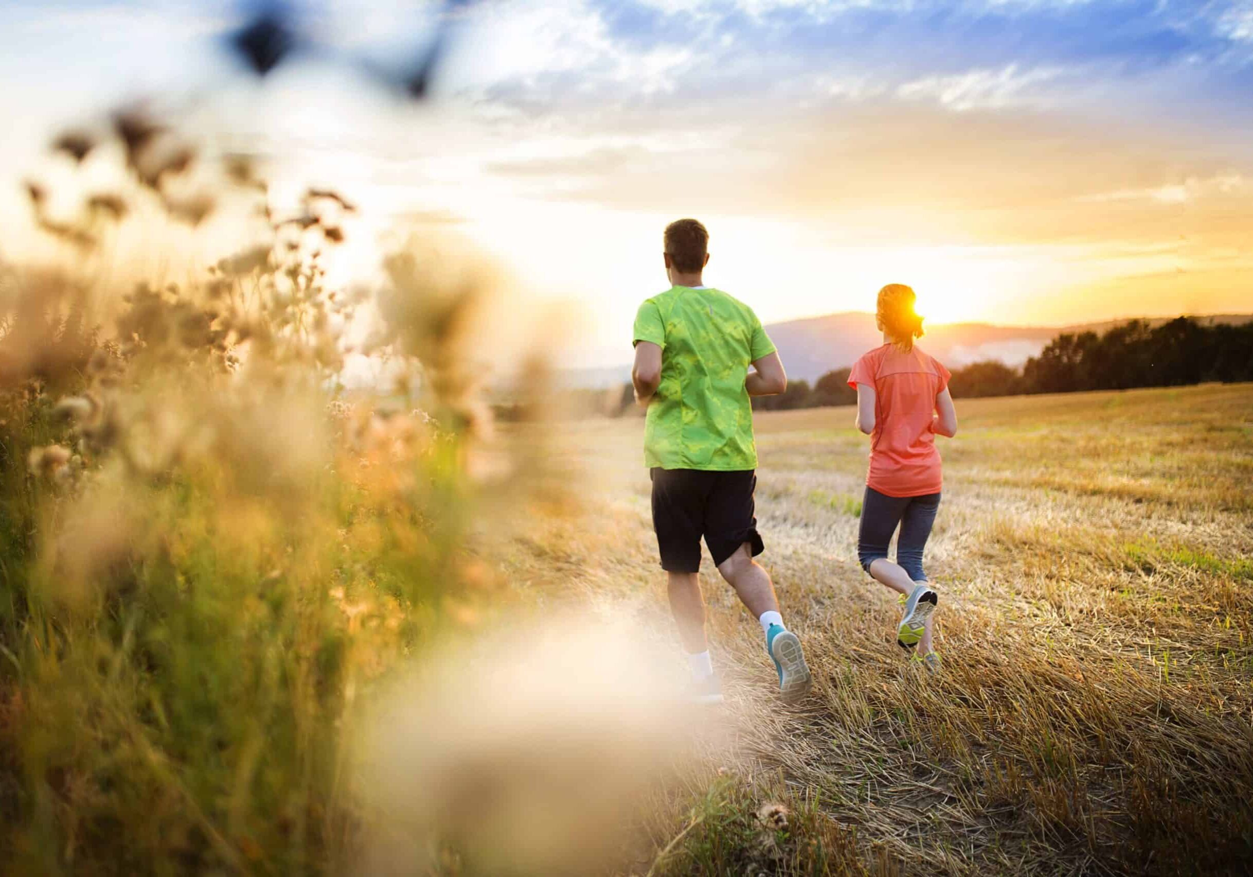 runner couple exercising-outside as part of their weight loss program