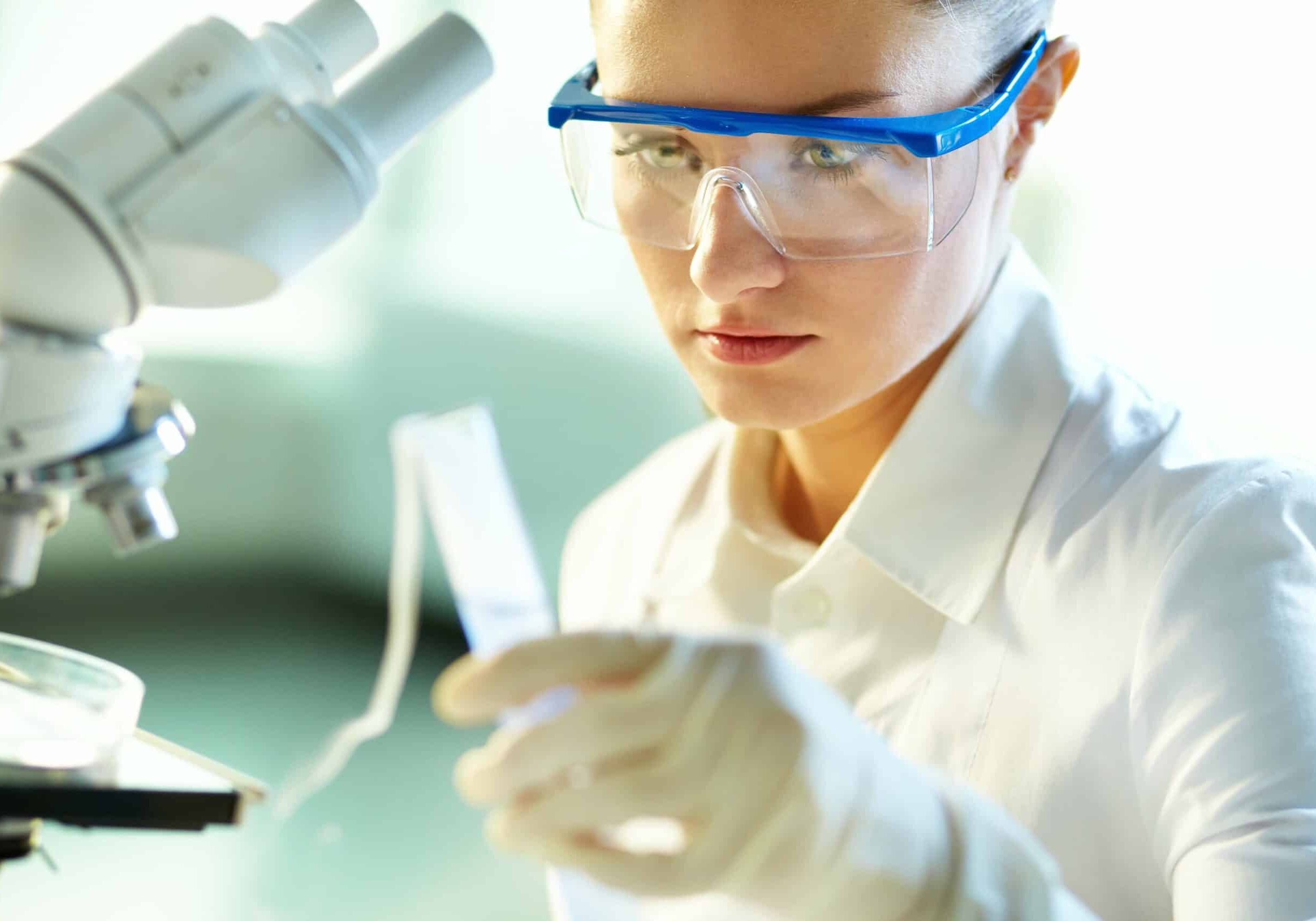 female-biochemist-researching-new-substances-in-chemical-lab