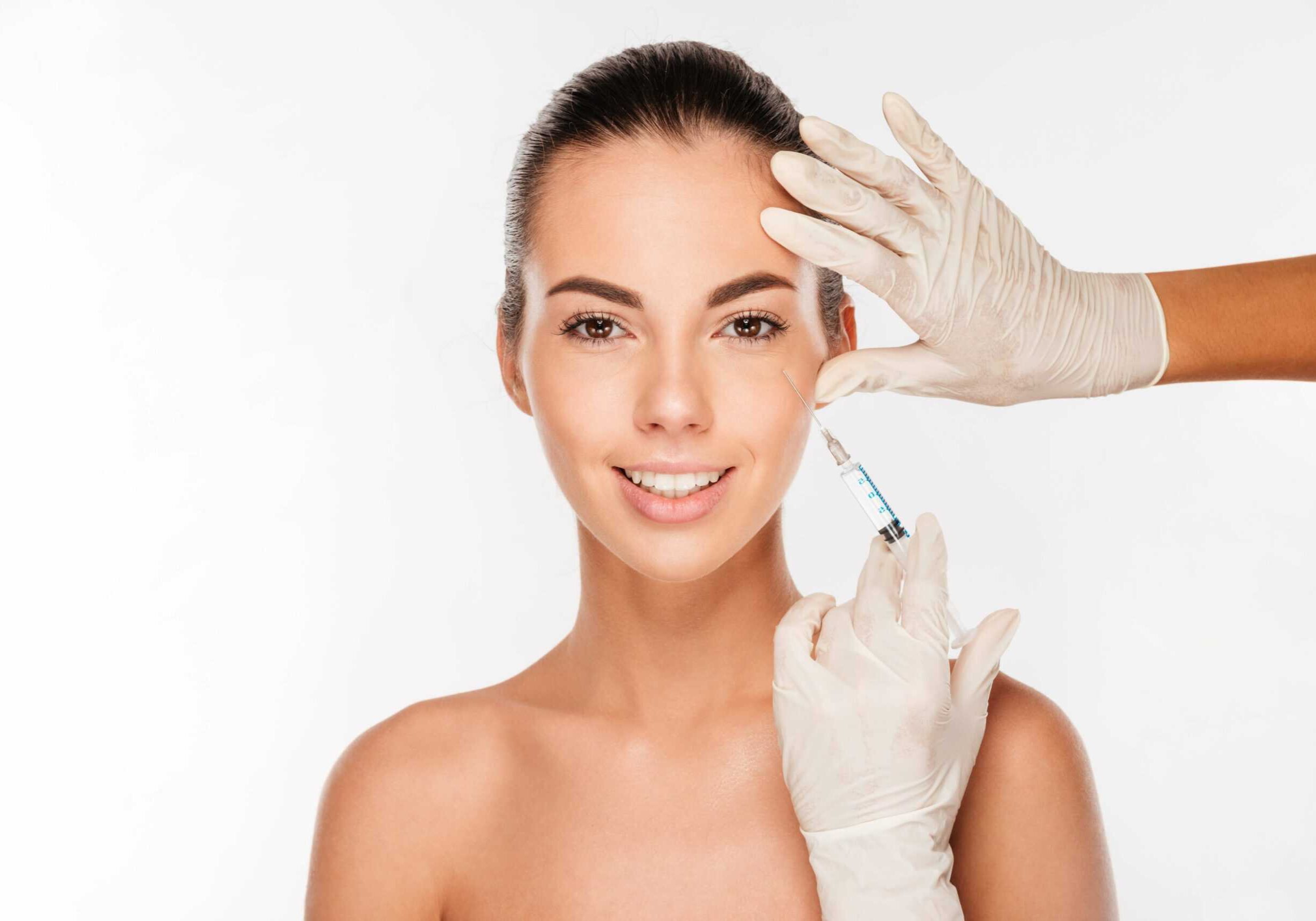 young-woman-receives-cosmetic-injection-from-professional-on-white-background